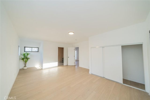 932 S Bon View Ave, Ontario, CA 91761 - unfurnished bedroom with light wood finished floors and a closet