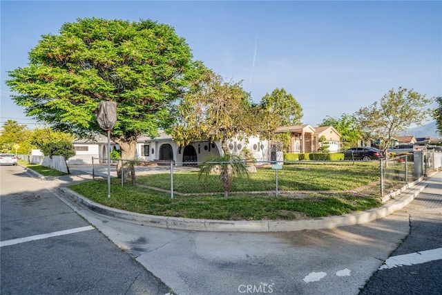 932 S Bon View Ave, Ontario, CA 91761 - view of property hidden behind natural elements featuring a fenced front yard