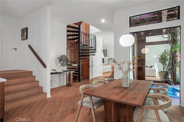 9955 Westwanda Dr, Beverly Hills, CA 90210 - dining area featuring stairs, wood finished floors, and recessed lighting
