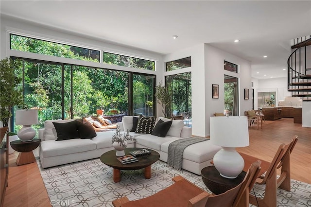 9955 Westwanda Dr, Beverly Hills, CA 90210 - living area featuring wood finished floors, stairs, and recessed lighting
