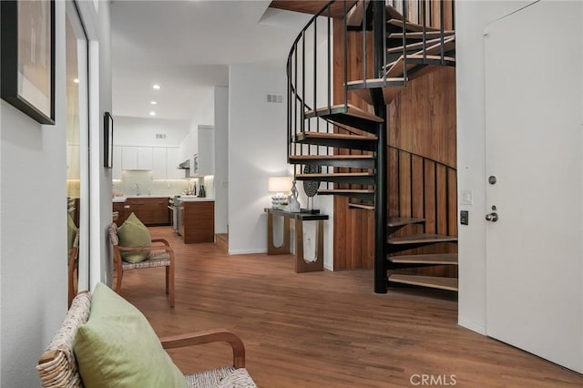 9955 Westwanda Dr, Beverly Hills, CA 90210 - staircase with wood finished floors, recessed lighting, and baseboards