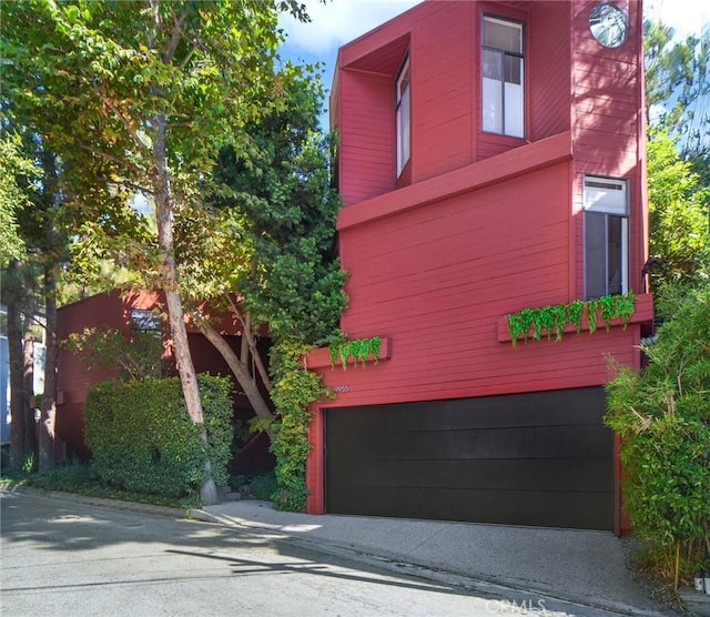 9955 Westwanda Dr, Beverly Hills, CA 90210 - view of property exterior featuring an attached garage