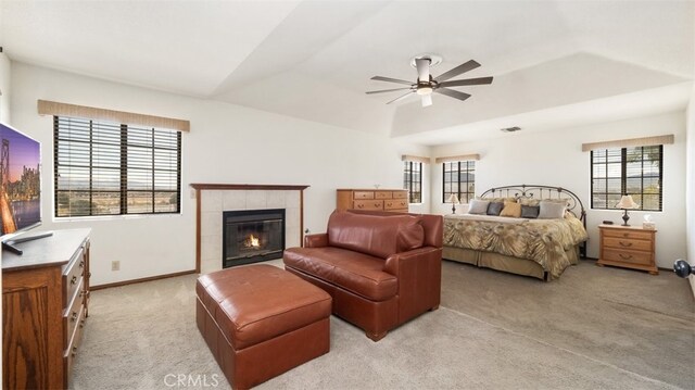 18668 Lemert St, Hesperia, CA 92345 - bedroom with a fireplace, multiple windows, light colored carpet, and vaulted ceiling