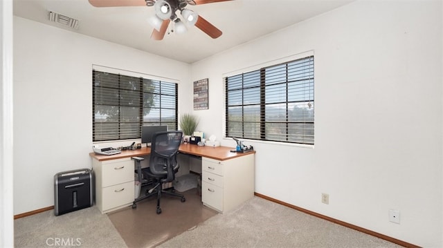 18668 Lemert St, Hesperia, CA 92345 - home office with light colored carpet, baseboards, a ceiling fan, and visible vents