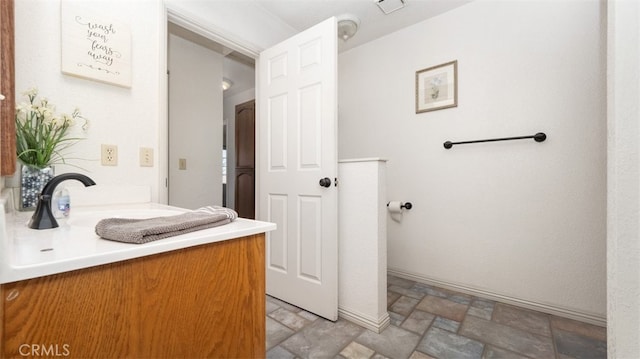 18668 Lemert St, Hesperia, CA 92345 - bathroom featuring visible vents, vanity, and stone finish flooring