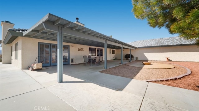 18668 Lemert St, Hesperia, CA 92345 - back of house with a patio area, french doors, a tile roof, and stucco siding