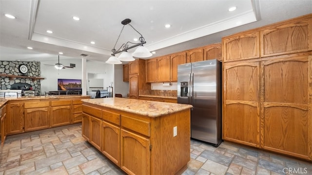 18668 Lemert St, Hesperia, CA 92345 - kitchen with stainless steel fridge with ice dispenser, a center island, stone finish floor, brown cabinetry, and a raised ceiling