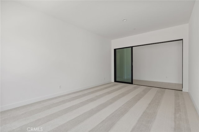empty room with baseboards