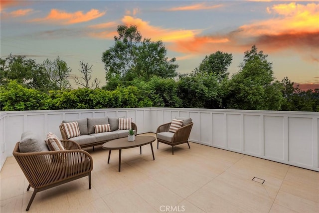 patio terrace at dusk with an outdoor hangout area