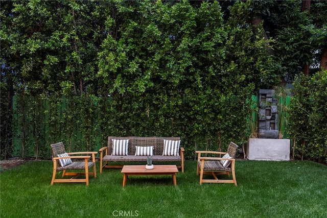 view of green lawn featuring an outdoor hangout area