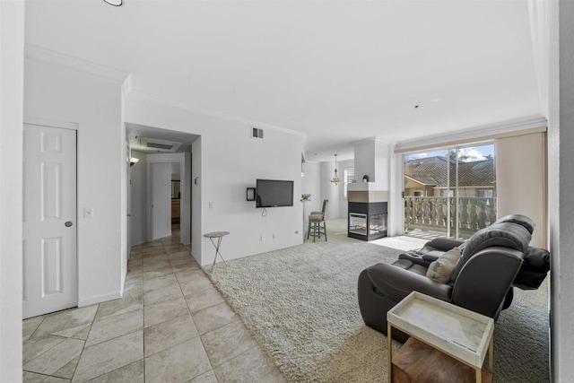 640 Camino De La Reina Unit 1309, San Diego, CA 92108 - living area featuring a multi sided fireplace, crown molding, and visible vents