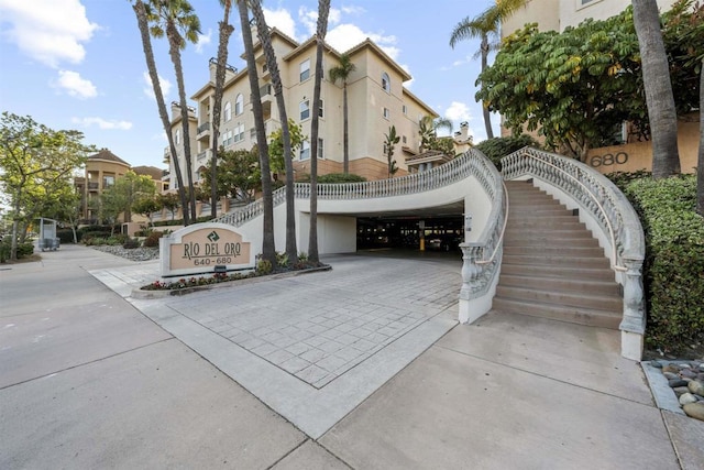 640 Camino De La Reina Unit 1309, San Diego, CA 92108 - exterior space featuring stucco siding and driveway