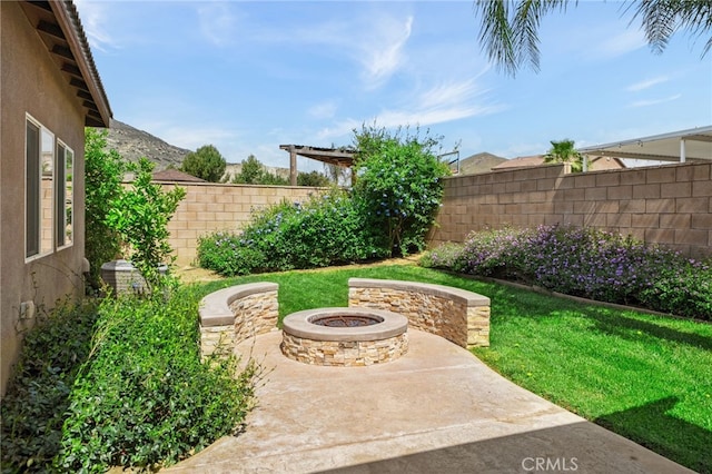 view of yard featuring an outdoor fire pit, a patio area, central air condition unit, and fence