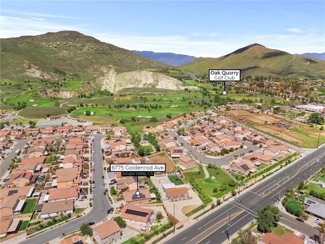bird's eye view with a residential view and a mountain view