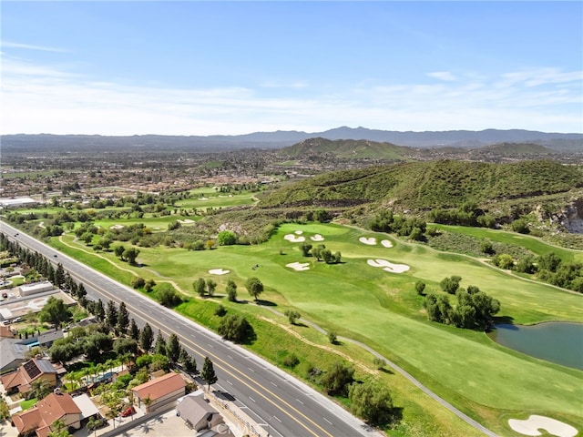 bird's eye view featuring golf course view and a water and mountain view