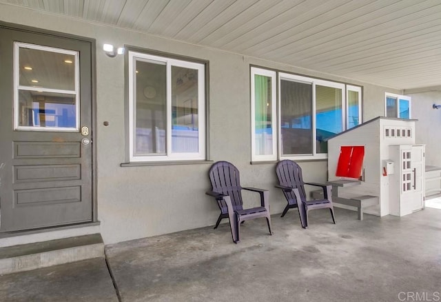 exterior space featuring stucco siding and a patio