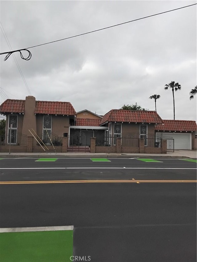 2002 W Civic Center Dr, Santa Ana, CA 92703 - mediterranean / spanish house featuring stucco siding and a tile roof
