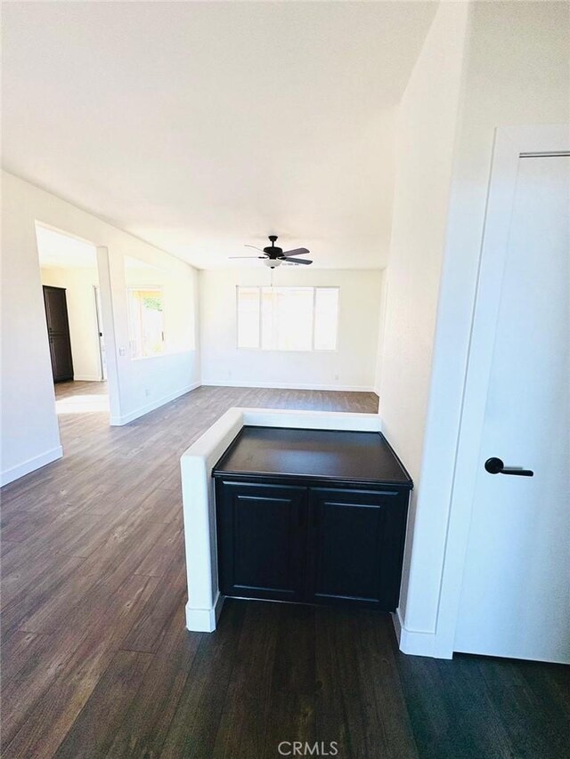 65565 Acoma Ave Unit 68, Desert Hot Springs, CA 92240 - interior space featuring dark wood-style flooring, baseboards, and a healthy amount of sunlight