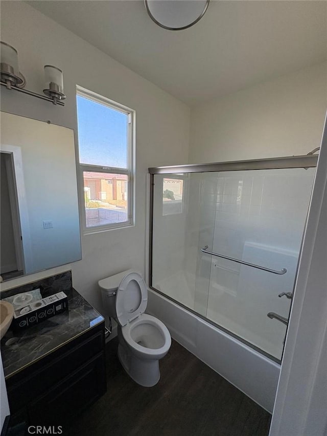 65565 Acoma Ave Unit 68, Desert Hot Springs, CA 92240 - full bath with bath / shower combo with glass door, wood finished floors, toilet, and a healthy amount of sunlight