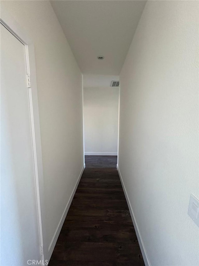 65565 Acoma Ave Unit 68, Desert Hot Springs, CA 92240 - hallway featuring baseboards, dark wood-style floors, and visible vents