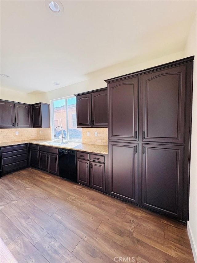65565 Acoma Ave Unit 68, Desert Hot Springs, CA 92240 - kitchen with tasteful backsplash, black dishwasher, a sink, and dark brown cabinetry