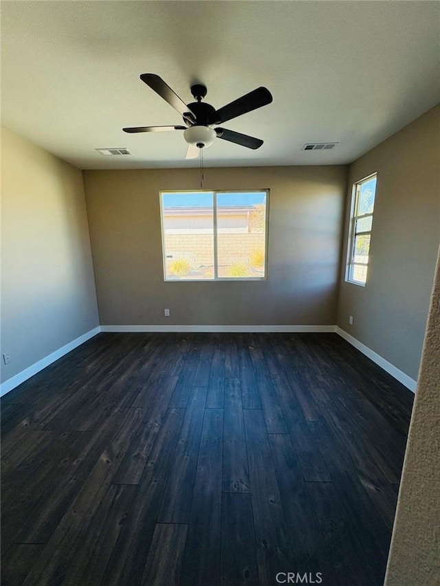 65565 Acoma Ave Unit 68, Desert Hot Springs, CA 92240 - empty room with dark wood-type flooring, visible vents, baseboards, and a ceiling fan