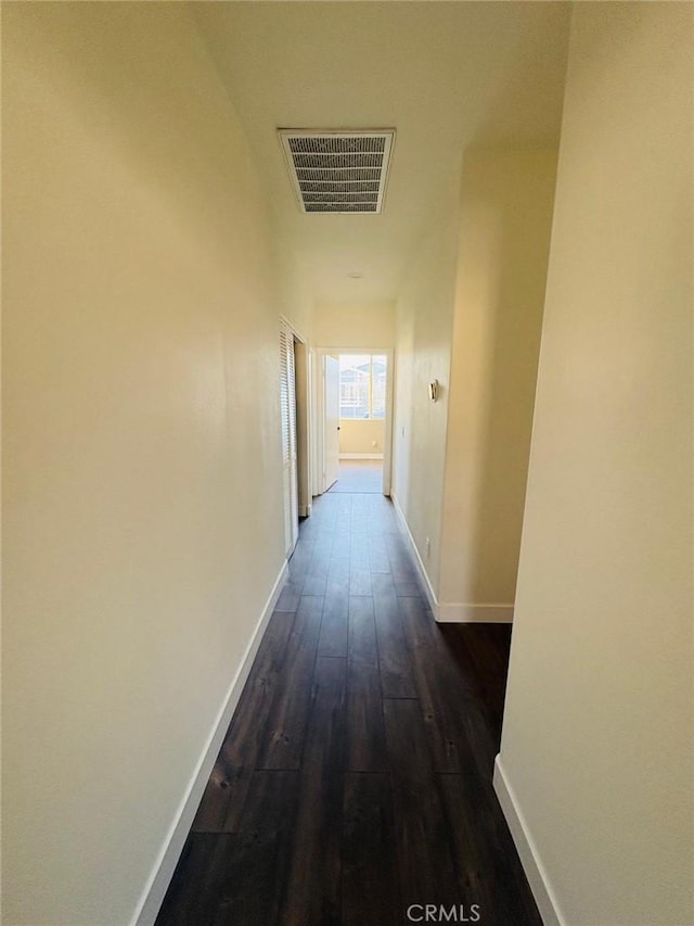 65565 Acoma Ave Unit 68, Desert Hot Springs, CA 92240 - corridor featuring dark wood-type flooring, visible vents, and baseboards