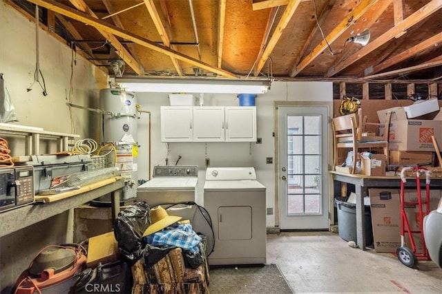 interior space with water heater and washer and clothes dryer