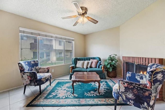 interior space featuring baseboards, tile patterned flooring, a textured ceiling, and a ceiling fan