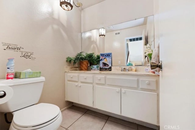 bathroom with visible vents, toilet, tile patterned flooring, and vanity