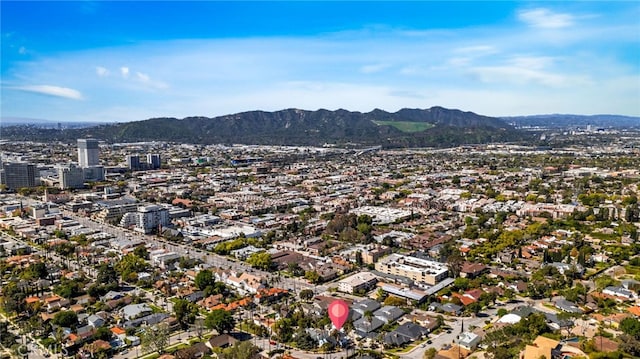 birds eye view of property featuring a city view and a mountain view