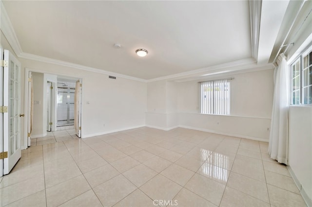 spare room featuring baseboards, light tile patterned floors, french doors, crown molding, and visible vents