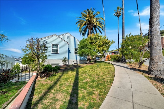 exterior space featuring a yard and fence