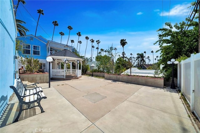 view of patio / terrace featuring a gazebo and fence