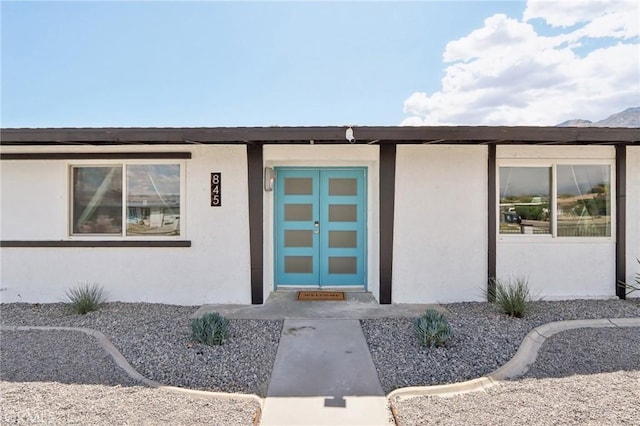 845 W Gateway Dr, Palm Springs, CA 92262 - view of exterior entry with stucco siding