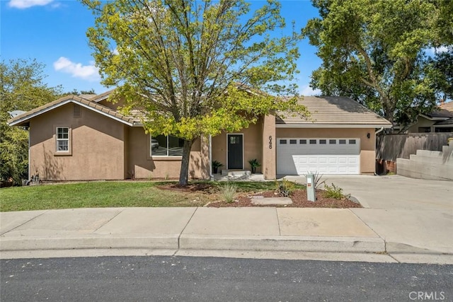 single story home featuring a tile roof, an attached garage, driveway, and stucco siding
