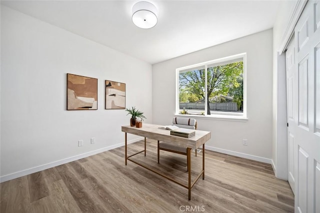 office featuring wood finished floors and baseboards