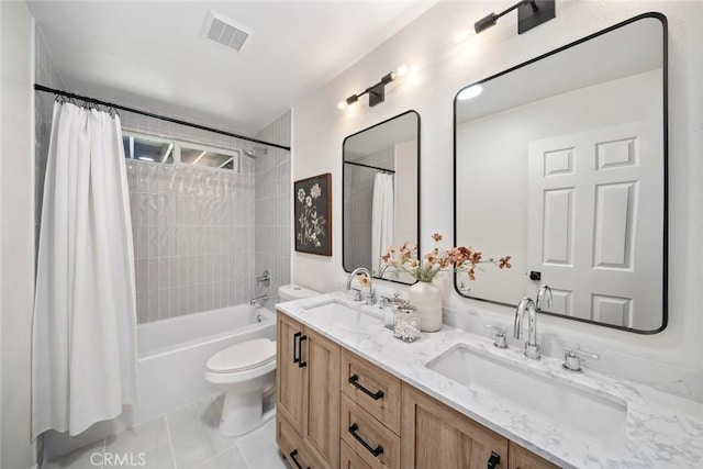 bathroom featuring shower / bath combo with shower curtain, visible vents, a sink, and toilet