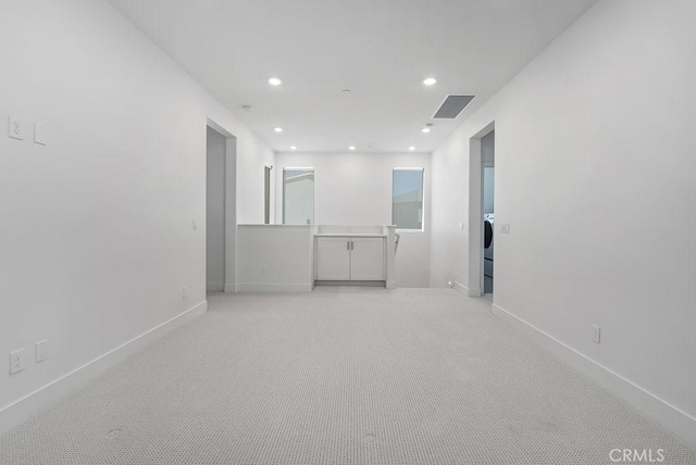120 Zawn, Irvine, CA 92618 - empty room with visible vents, baseboards, recessed lighting, and light colored carpet
