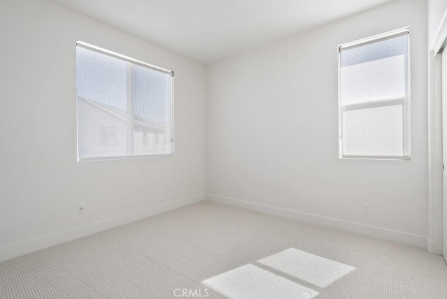 120 Zawn, Irvine, CA 92618 - empty room with baseboards and light carpet