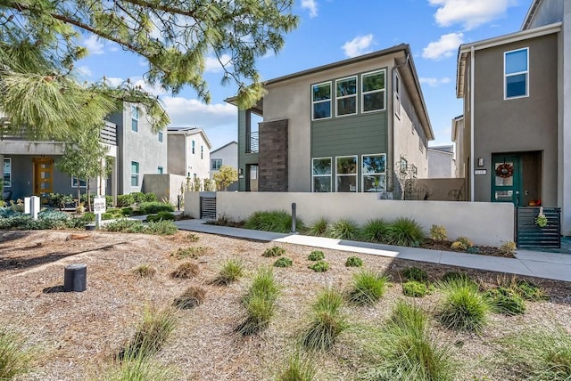 120 Zawn, Irvine, CA 92618 - view of front facade featuring a residential view, stucco siding, and fence