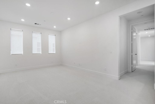 120 Zawn, Irvine, CA 92618 - spare room with visible vents, baseboards, recessed lighting, and light carpet