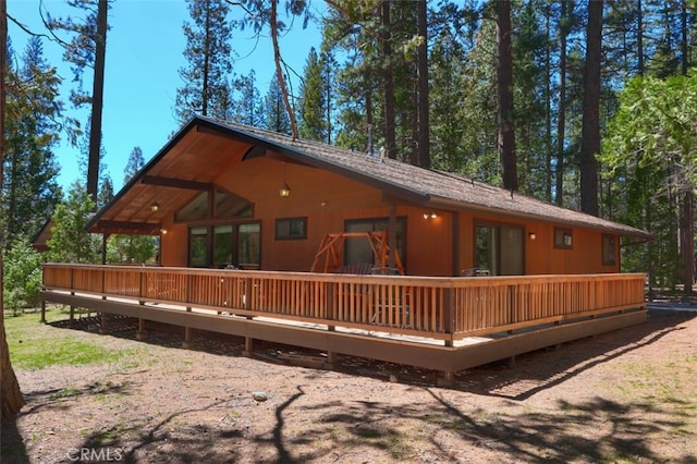 back of property with a wooden deck