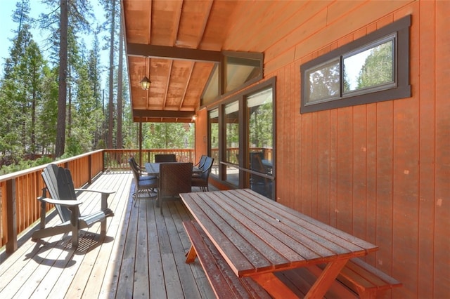 deck featuring outdoor dining area