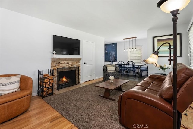 3556 Rutgers Ave, Long Beach, CA 90808 - living room with wood finished floors and a fireplace