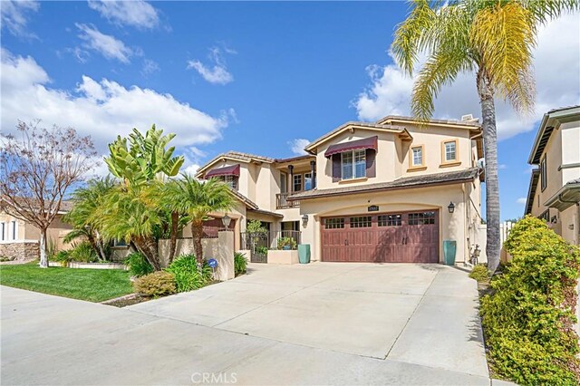 37557 Windsor Ct, Murrieta, CA 92562 - mediterranean / spanish home featuring stucco siding, a garage, concrete driveway, and fence