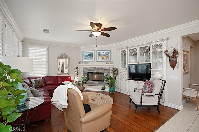 37557 Windsor Ct, Murrieta, CA 92562 - living area featuring dark wood finished floors, visible vents, ornamental molding, and a ceiling fan