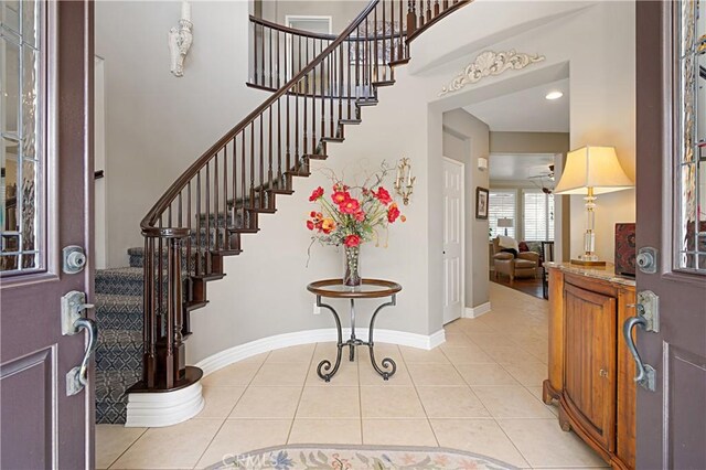 37557 Windsor Ct, Murrieta, CA 92562 - foyer entrance featuring baseboards, stairs, and light tile patterned floors