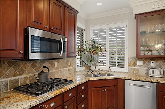 37557 Windsor Ct, Murrieta, CA 92562 - kitchen featuring a sink, light stone countertops, ornamental molding, and appliances with stainless steel finishes