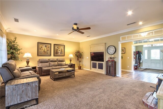 41548 Hutchison Ct, Murrieta, CA 92562 - carpeted living room with crown molding, a ceiling fan, and baseboards